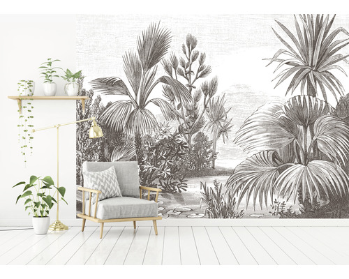 Wohnzimmer mit Sessel und Fototapete mit Pflanzenmotiven