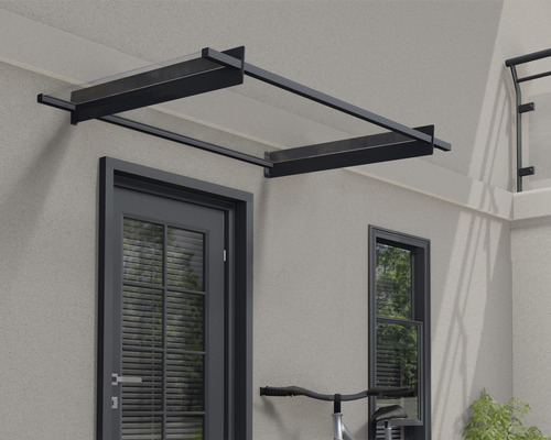 Vordach aus Glas und Metall über einer Haustür