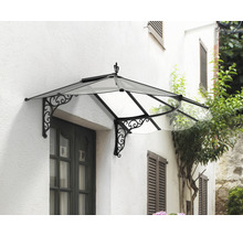 Vordach mit dekorativen Verzierungen über einer Tür