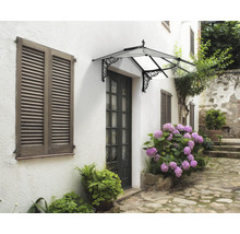 Haustürvordach mit geschwungenen Trägern an einem Haus