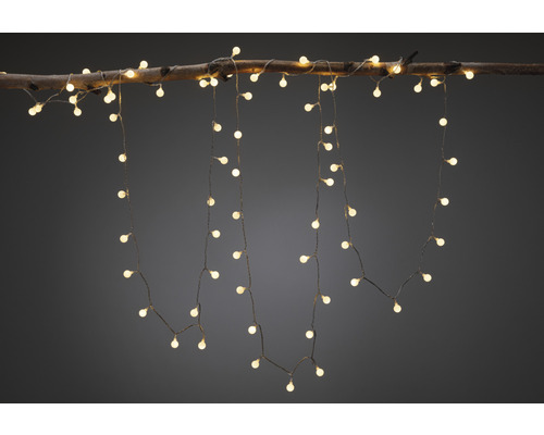 Guirlande lumineuse décorative avec lumière blanche chaude fixée sur une branche