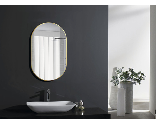 Miroir ovale avec lavabo dans une salle de bains