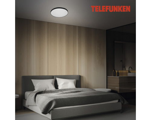 Schlafzimmer mit Deckenleuchte und Telefunken Logo