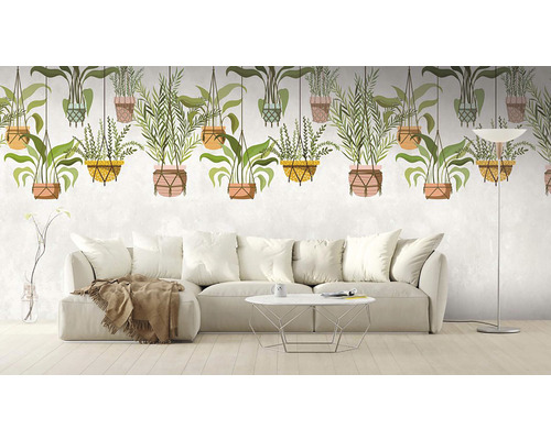 Wohnzimmer mit Sofa und Fototapete mit Pflanzenmotiven