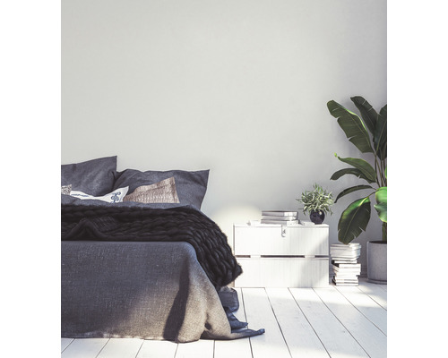 Chambre à coucher avec lit, table de chevet et plantes d''intérieur