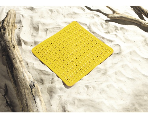 Tapis de bain jaune avec structure à picots