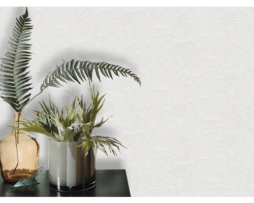 Gros plan d''un papier peint structuré blanc avec arrangement de plantes