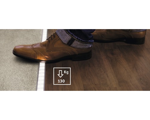 Profilé de revêtement de sol entre moquette et plancher en bois avec symbole de capacité de charge de 130 kilogrammes