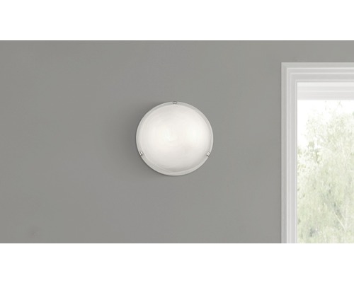 Runde Wandleuchte an einer Wand montiert.