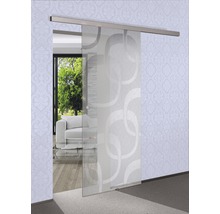 Porte coulissante en verre avec motif devant un salon