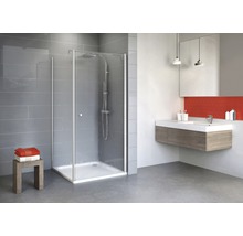 Salle de bain moderne avec cabine de douche, lavabo et miroir