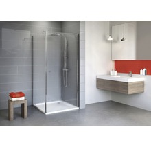 Salle de bains moderne avec cabine de douche, lavabo et carrelage gris