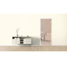 Ambiance de pièce avec porte en verre à motif géométrique et commode