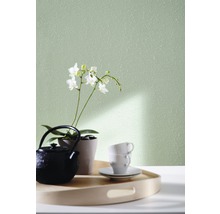 Mur décoratif avec théière, tasses et orchidée