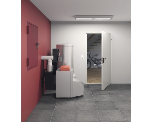 Installation de chauffage dans une cave avec porte et carrelage