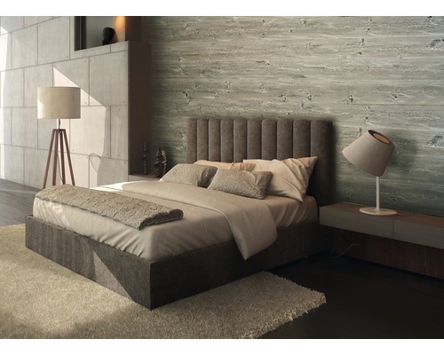 Chambre à coucher avec lit, lampe de chevet et revêtement mural en bois