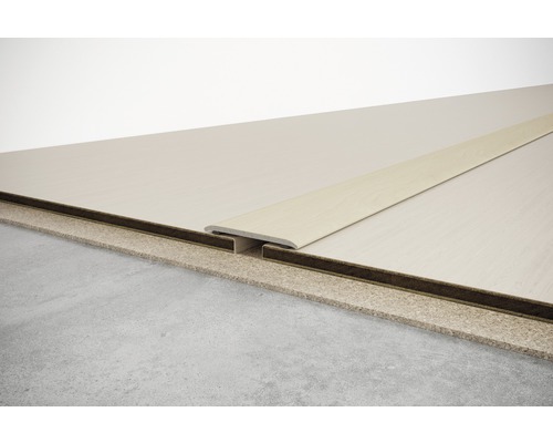 Profilé de sol pour raccorder deux revêtements de sol