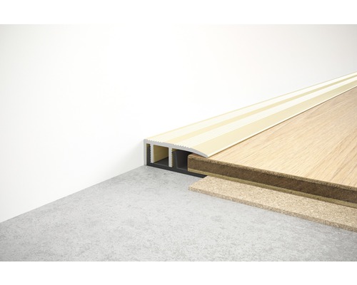 Profilé de transition pour revêtements de sol entre le mur et le plancher en bois