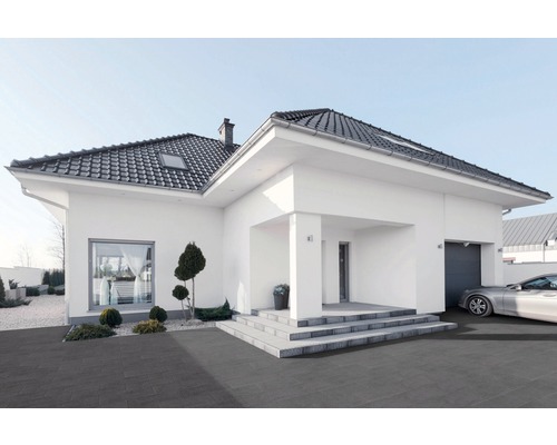 Maison moderne avec toit foncé et allée pavée