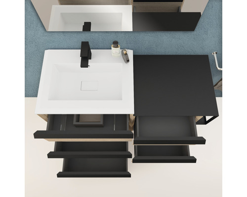 Meuble-lavabo avec système de tiroirs ouverts en noir et blanc vu de dessus