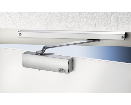 Ferme-porte monté sur une porte