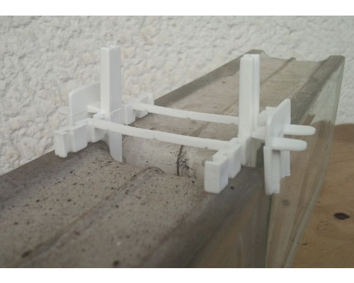 Système de nivellement de carreaux sur support en ciment