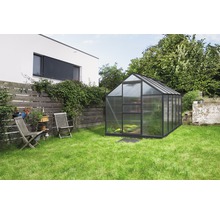 Serre de jardin avec pelouse et mobilier de jardin