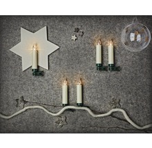 Décoration avec bougies LED à clip et motifs de Noël sur fond gris