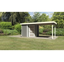 Abri de jardin avec annexe sur une pelouse