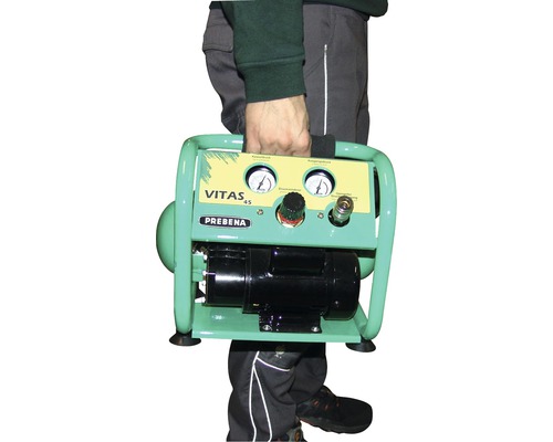 Une personne transporte un compresseur portatif Prebena Vitas 45.