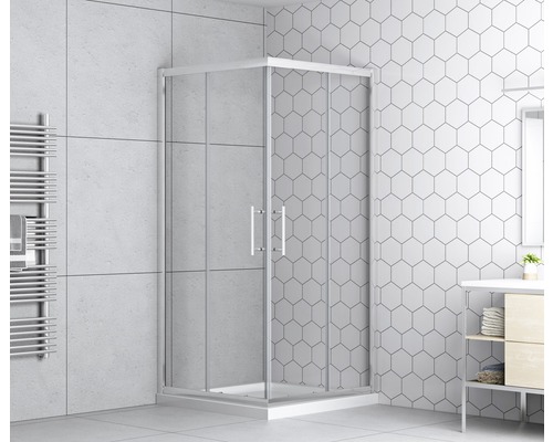 Eckdusche mit Glastüren in einem Badezimmer mit Fliesen