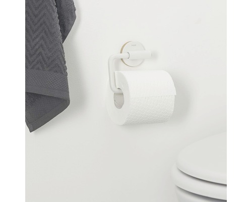 Porte-papier toilette avec rouleau de papier sur le mur
