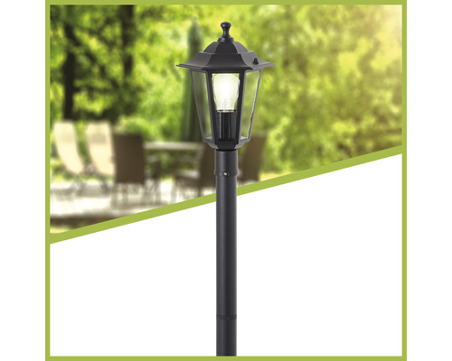 Lampadaire de jardin noir en métal avec ampoule allumée