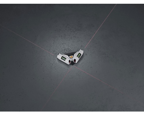 Niveau laser croisé projetant des lignes laser sur le sol