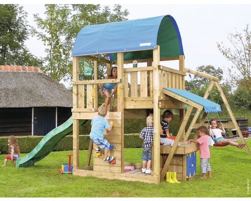 Tour de jeu avec toboggan, balançoire et mur d''escalade dans le jardin