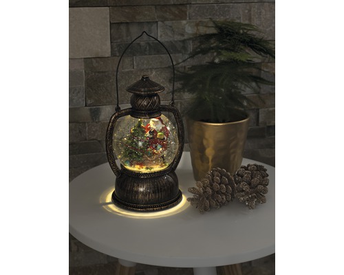 Lanterne décorative boule à neige avec motif de Noël et éclairage.