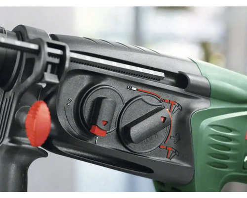 Gros plan d''une perceuse avec des sélecteurs pour régler différents modes de perçage