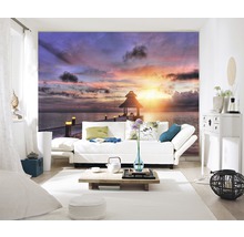 Salon avec papier peint photo d''un coucher de soleil sur la mer