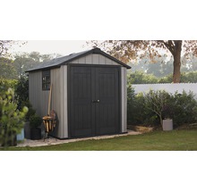Abri de jardin dans le jardin avec réserve de bois et fenêtre