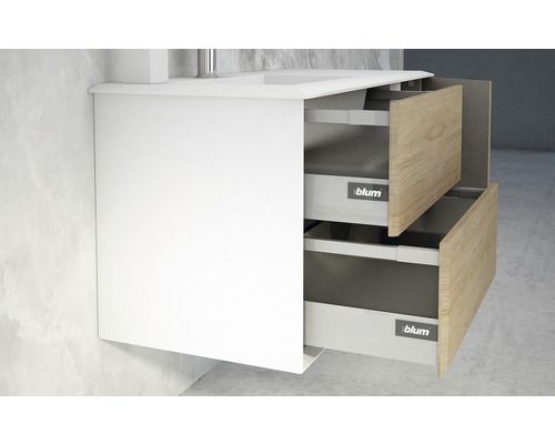 Meuble sous-lavabo avec deux tiroirs ouverts à façade en bois