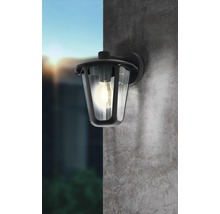 Applique murale avec ampoule sur un mur gris