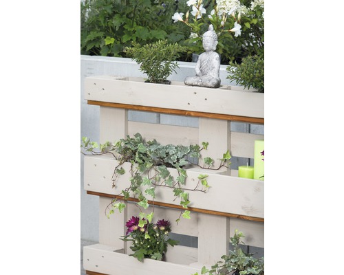 Palette plantée avec une figurine de Bouddha pour le jardin ou le balcon