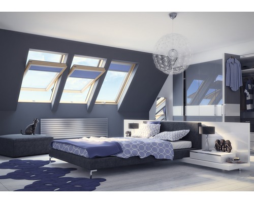 Chambre moderne avec fenêtres de toit, lit et armoire