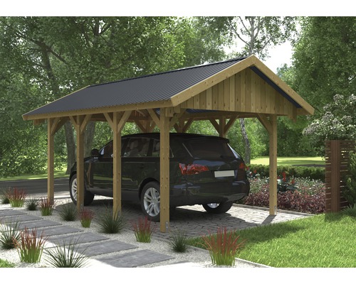 Carport mit Autoeinfahrt und geparktem Auto.