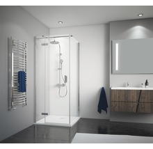 Salle de bains avec cabine de douche, sèche-serviettes, meuble-lavabo et miroir