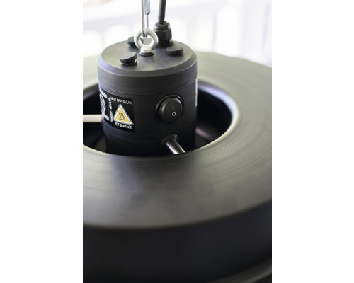 Detailaufnahme einer Heizstrahleroberseite mit Schalter und Warnhinweis heiße Oberfläche