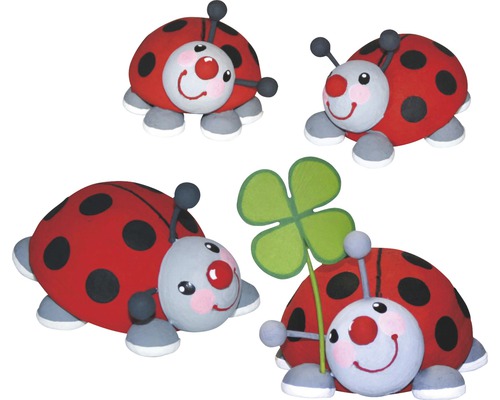 Dekorative Marienkäferfiguren mit Kleeblatt