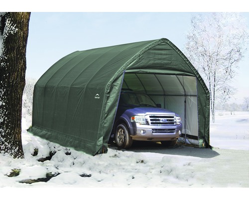 Voiture dans un garage de tente vert résistant aux intempéries en hiver