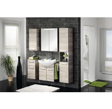 Salle de bain lumineuse avec lavabo, armoire de toilette, armoires suspendues et carrelage noir.