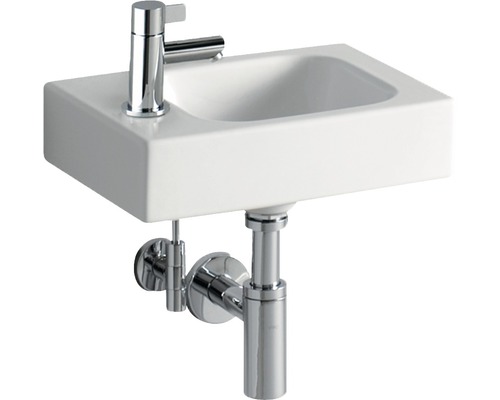 Vasque à poser blanche avec robinetterie chromée et siphon